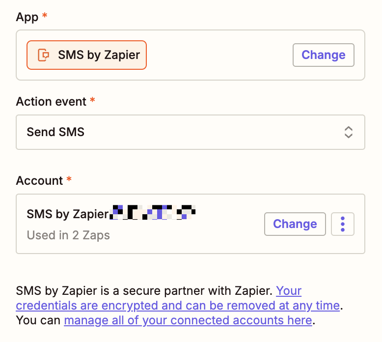 An action step in the Zap editor with SMS by Zapier selected for the action app and Send SMS selected for the action event.